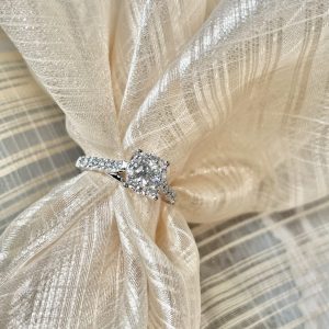 White Gold Engagement Ring with 0.62 Central plus surrounding round Diamonds